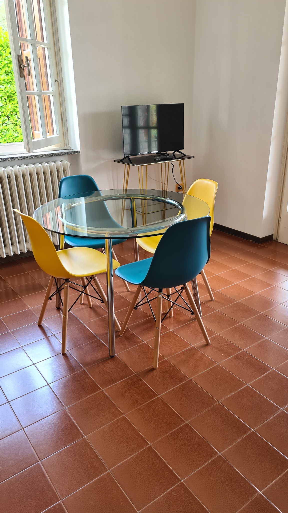 Actual dining area with table, chairs and TV