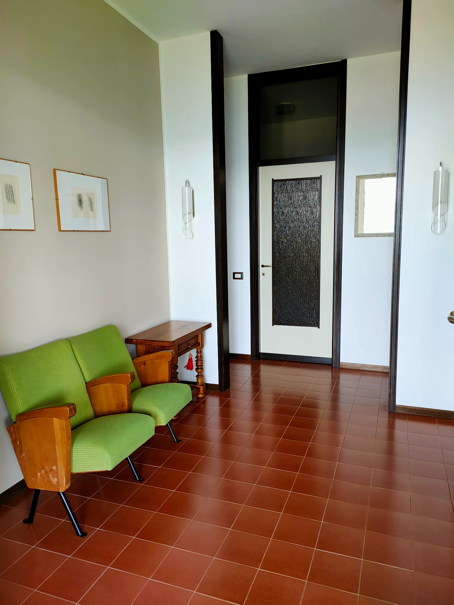 Actual Casa Luigi entrance area with green armchairs